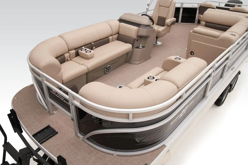 Slide: The Image of 2024 Sun Tracker SportFish 22 DLX pontoon boat with beige seating and spacious deck. - 26