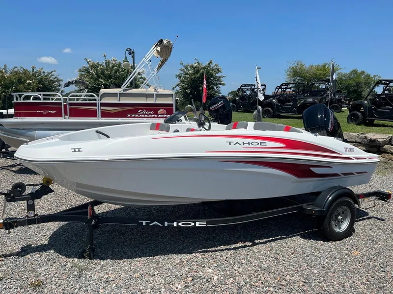 Slide: The Image of 2024 Tahoe T16 boat with red and white design on a trailer. - 1