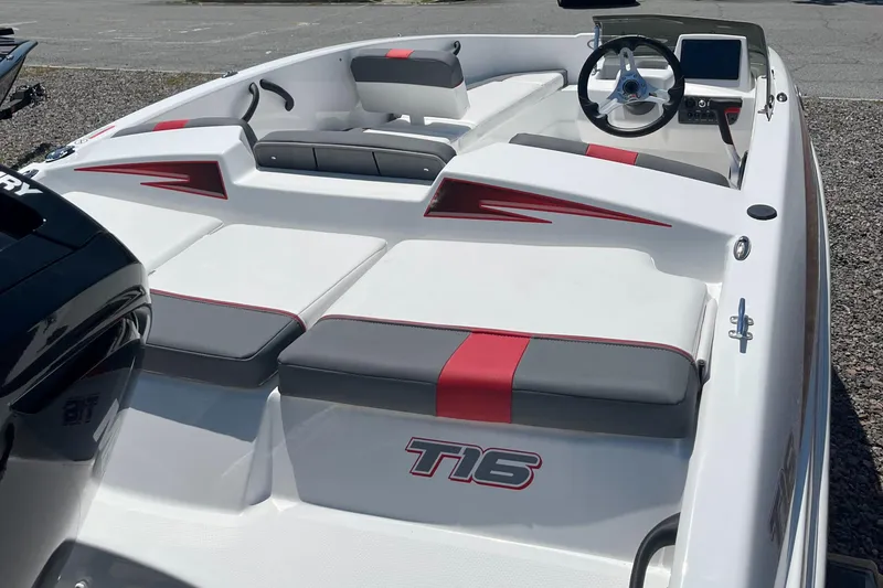Slide: The Image of 2024 Tahoe T16 boat interior with red and gray seating. - 5