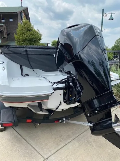 Slide: The Image of 2024 Tahoe 2150 boat with powerful outboard motor on trailer. - 4