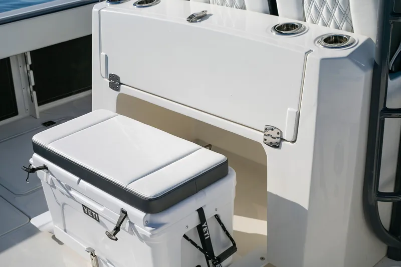 Slide: The Image of 2022 World Cat 400CC-X boat interior with cooler and seating. - 12