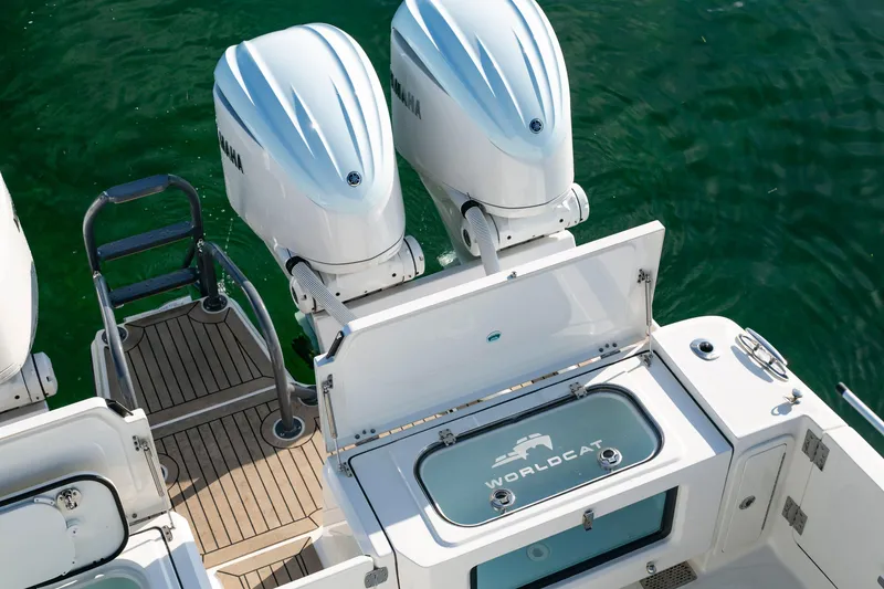 Slide: The Image of 2022 World Cat 400CC-X boat with twin Yamaha engines and open storage compartment. - 16