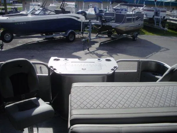 Slide: The Image of 2023 Bennington 21LSAPG pontoon boat interior with seating and storage. - 5