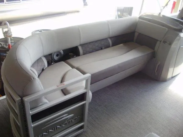 Slide: The Image of 2023 Bennington 21LSAPG pontoon boat interior with plush seating. - 8
