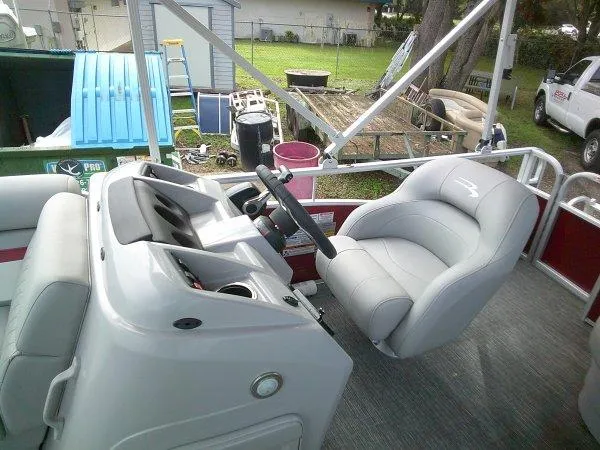 Slide: The Image of 2024 Bennington 188SVL boat interior with steering wheel and comfortable seating. - 4