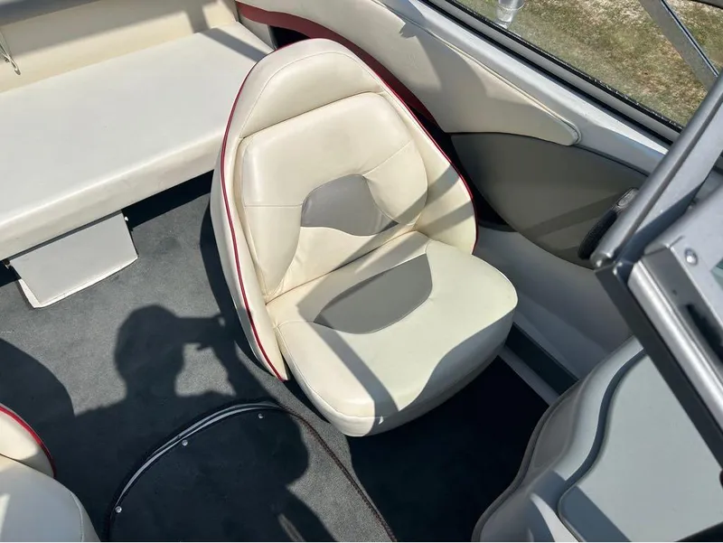 Slide: The Image of Interior of 2000 Four Winns Horizon 170 boat with white and gray seating. - 4