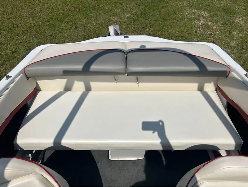 Slide: The Image of Rear seating area of a 2000 Four Winns Horizon 170 boat with white and gray upholstery. - 5