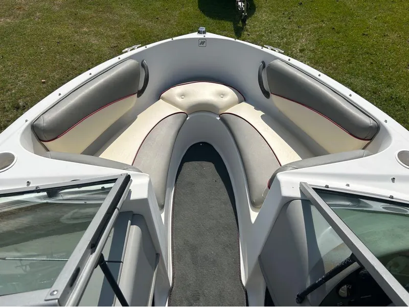 Slide: The Image of 2000 Four Winns Horizon 170 boat interior with cushioned seating. - 6