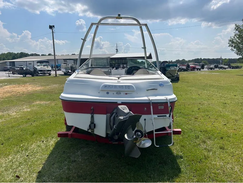 Slide: The Image of 2000 Four Winns Horizon 170 boat on grass, rear view. - 7