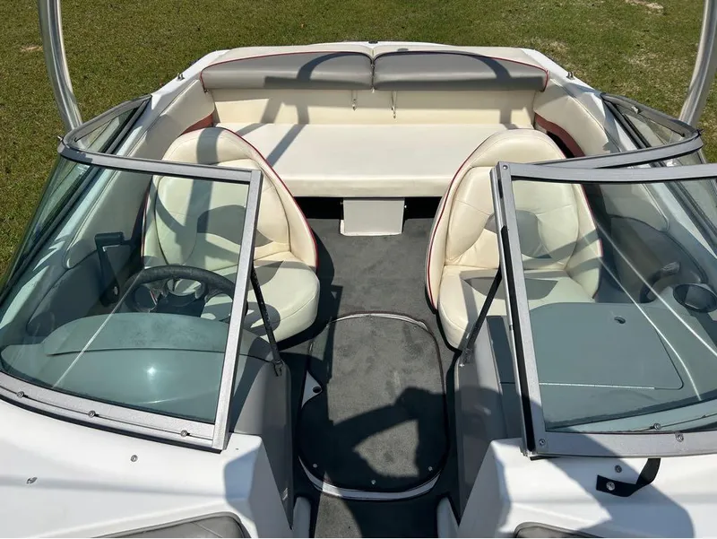Slide: The Image of Interior of a 2000 Four Winns Horizon 170 boat with seating and steering wheel. - 8