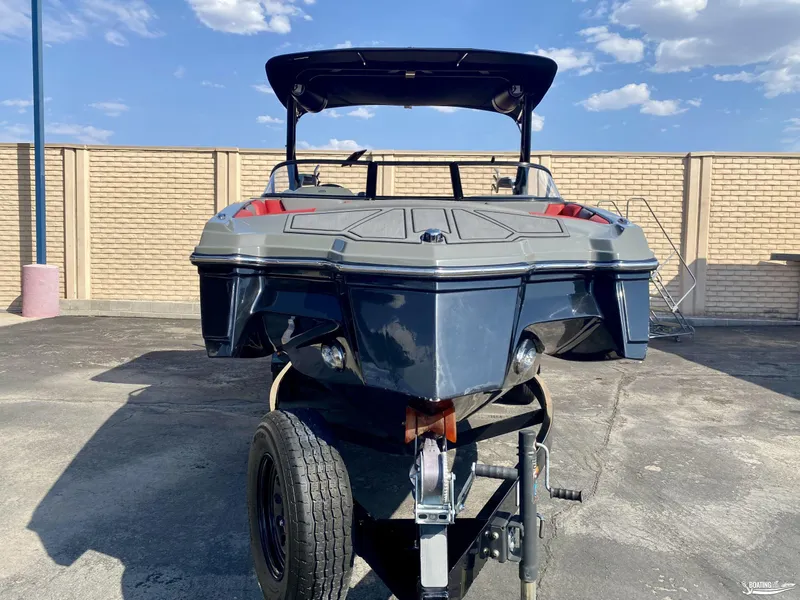 Slide: The Image of 2022 Heyday WTSurf boat on trailer, front view, outdoor setting. - 2