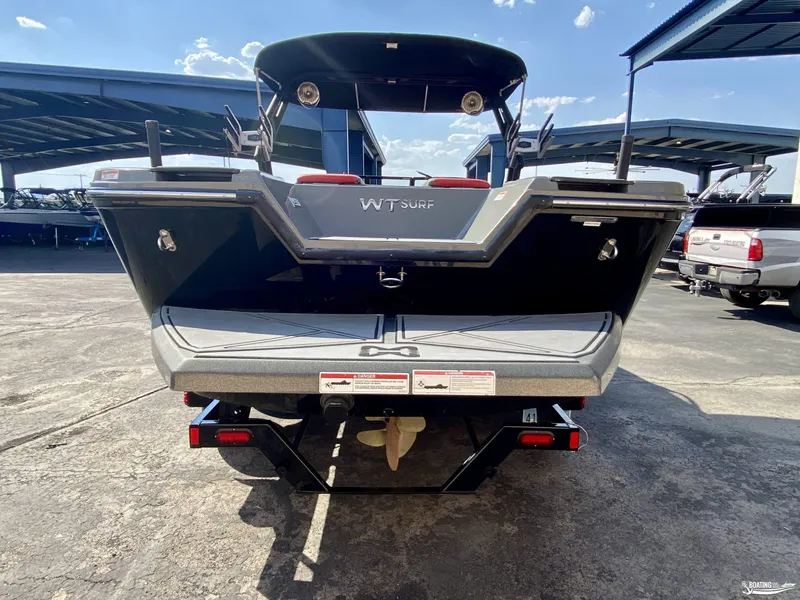 Slide: The Image of 2022 Heyday WTSurf boat rear view at a marina. - 3