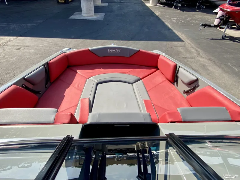 Slide: The Image of 2022 Heyday WTSurf boat with red and gray seating, front view. - 6