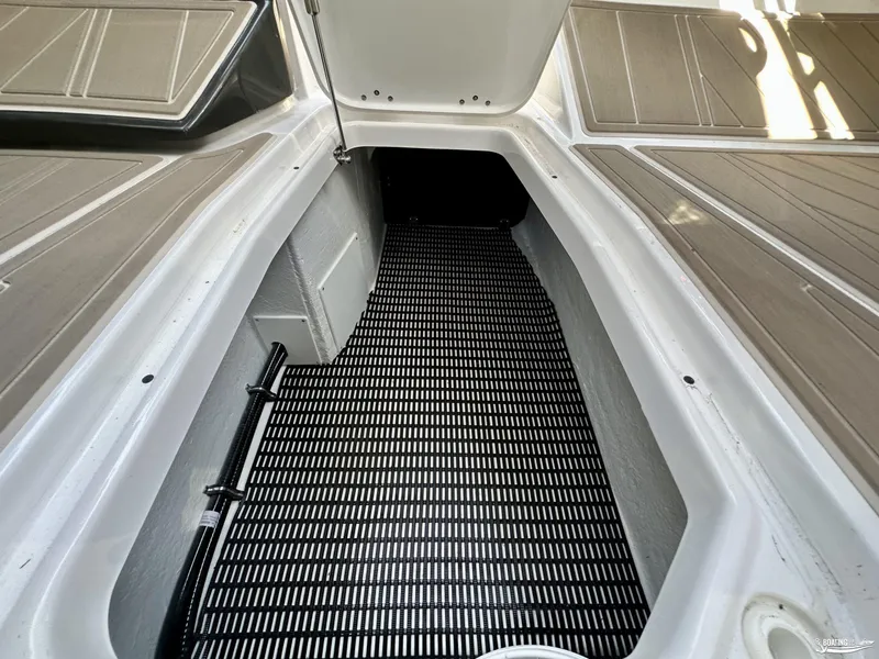 Slide: The Image of 2024 Monterey 305SS boat storage compartment with non-slip flooring. - 10
