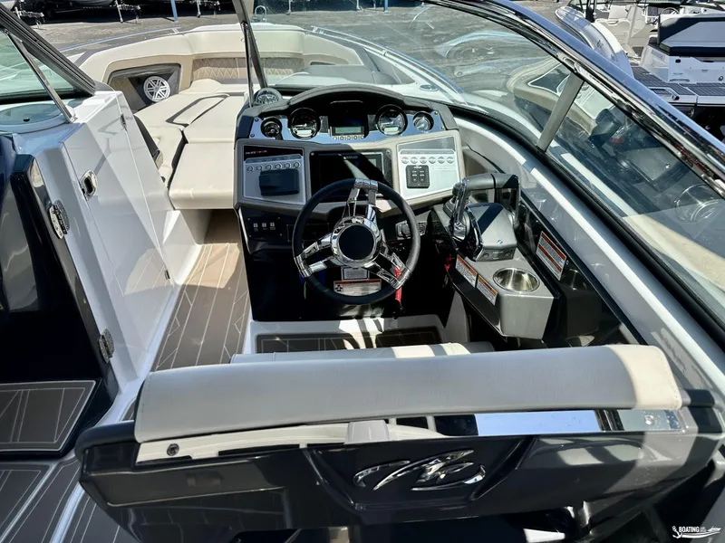 Slide: The Image of 2024 Monterey 305SS boat cockpit with modern steering and control panel. - 6
