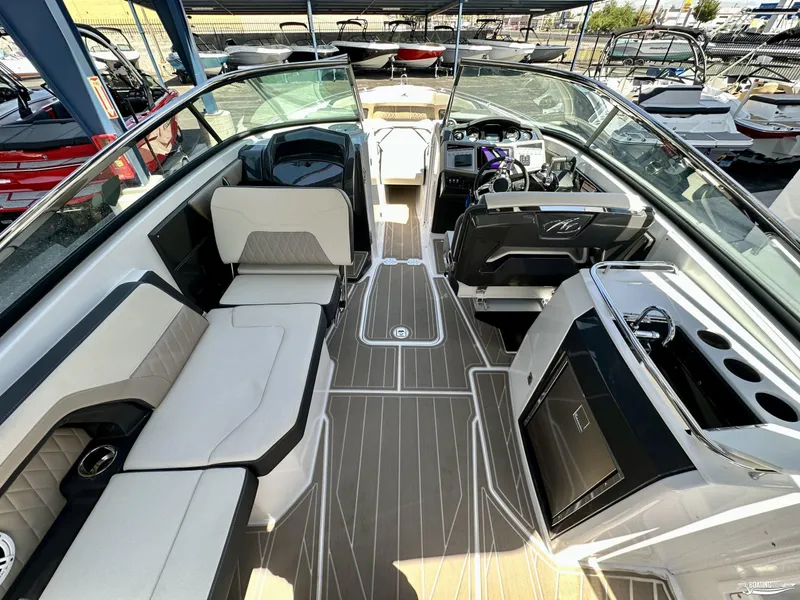 Slide: The Image of 2024 Monterey 305SS boat interior with modern seating and sleek dashboard design. - 7