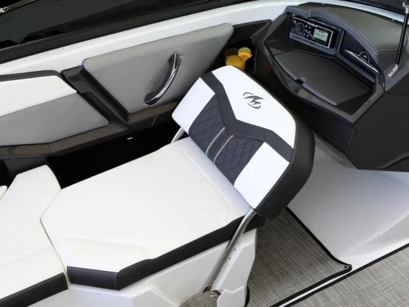 Slide: The Image of 2023 Monterey 238SS boat interior with white and black seating and dashboard. - 4