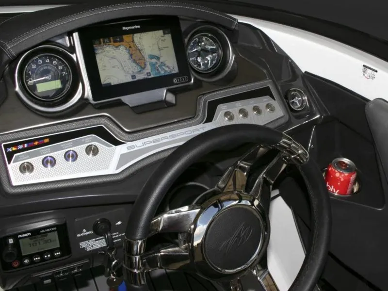 Slide: The Image of 2023 Monterey 238SS boat dashboard with navigation screen and steering wheel. - 5