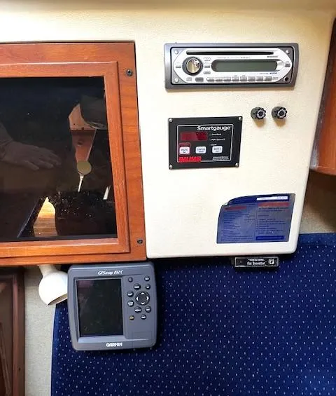 Slide: The Image of Control panel of a 1986 Pearson 303 sailboat with navigation and audio equipment. - 31