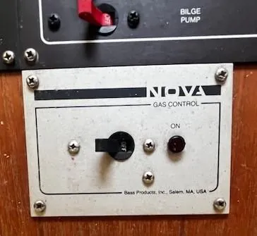 Slide: The Image of Nova gas control panel on Pearson 303, 1986 model, with bilge pump switch. - 34