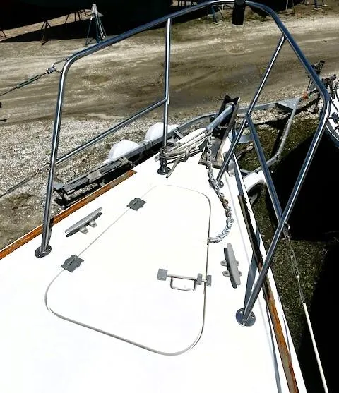 Slide: The Image of 1986 Pearson 303 sailboat deck with stainless steel railings and anchor chain. - 6