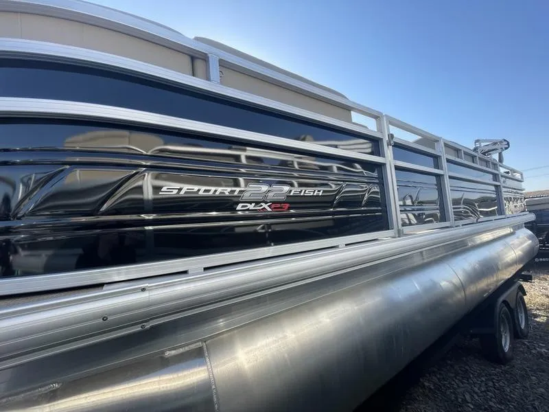 The Image of 2024 Sun Tracker SportFish 22 XP3 pontoon boat side view. - 1