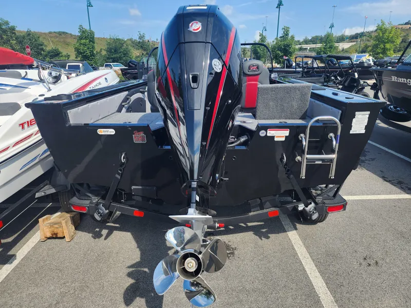 Slide: The Image of 2023 Ranger VX1888 WT boat with outboard motor in parking lot. - 5