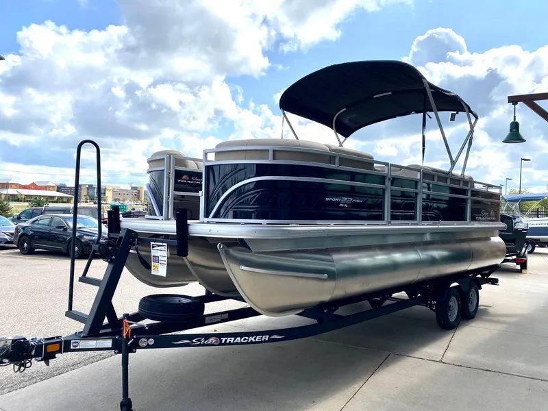 The Image of 2024 Sun Tracker SportFish 22 XP3 pontoon boat on trailer. - 0