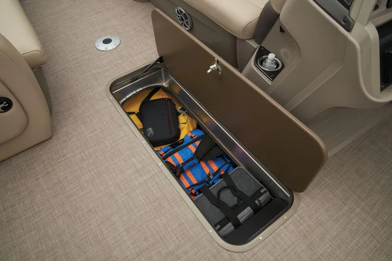 Slide: The Image of Sun Tracker SportFish 22 XP3 2024 under-seat storage with life jackets and gear. - 46