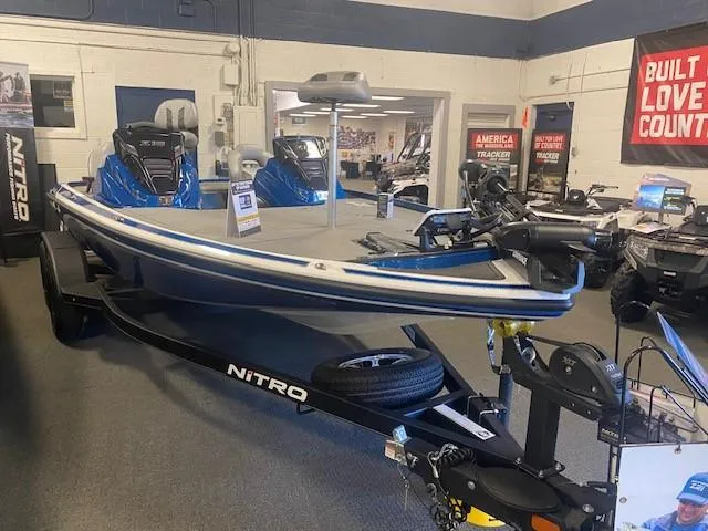 Slide: The Image of 2024 Nitro Z18 Pro boat displayed in showroom on trailer. - 1