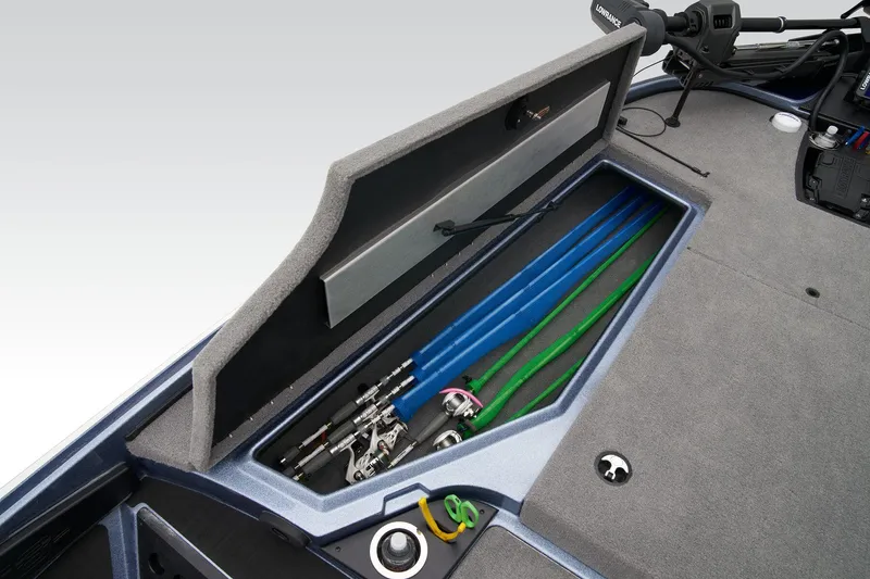 Slide: The Image of 2024 Nitro Z18 Pro boat with open storage compartment for fishing rods. - 12