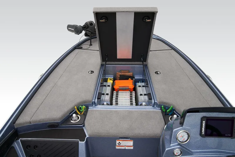 Slide: The Image of 2024 Nitro Z18 Pro boat with open storage compartment and control panel. - 15
