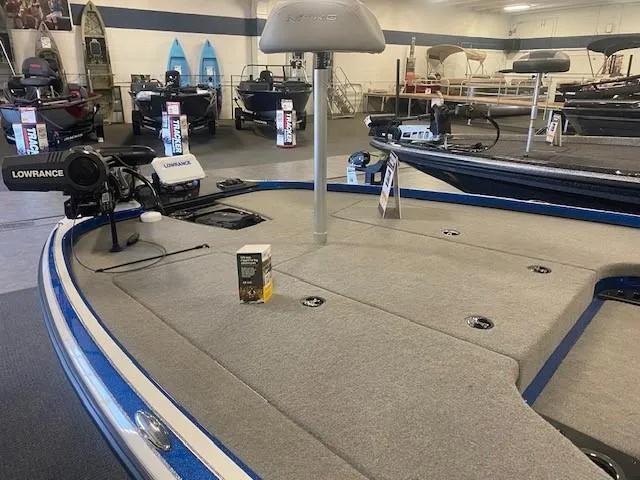 Slide: The Image of 2024 Nitro Z18 Pro fishing boat in showroom, featuring Lowrance electronics. - 8