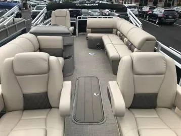 Slide: The Image of 2024 Sun Tracker Sportfish 24 XP3 pontoon boat with spacious seating and modern design. - 10