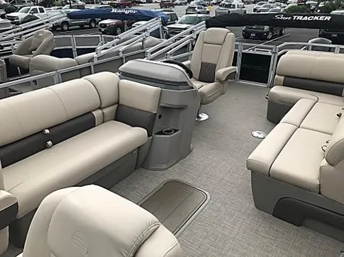 Slide: The Image of 2024 Sun Tracker Sportfish 24 XP3 pontoon boat interior with beige seating. - 14