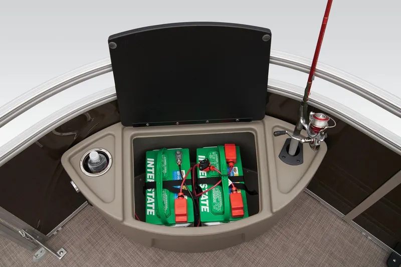 Slide: The Image of Sun Tracker Sportfish 24 XP3 2024 boat battery storage compartment with fishing rod holder. - 24