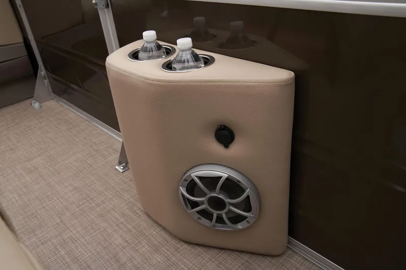 Slide: The Image of 2024 Sun Tracker Sportfish 24 XP3 cup holders and speaker detail. - 27
