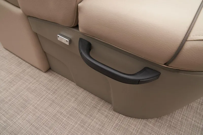 Slide: The Image of 2024 Sun Tracker Sportfish 24 XP3 seat handle and storage compartment. - 49