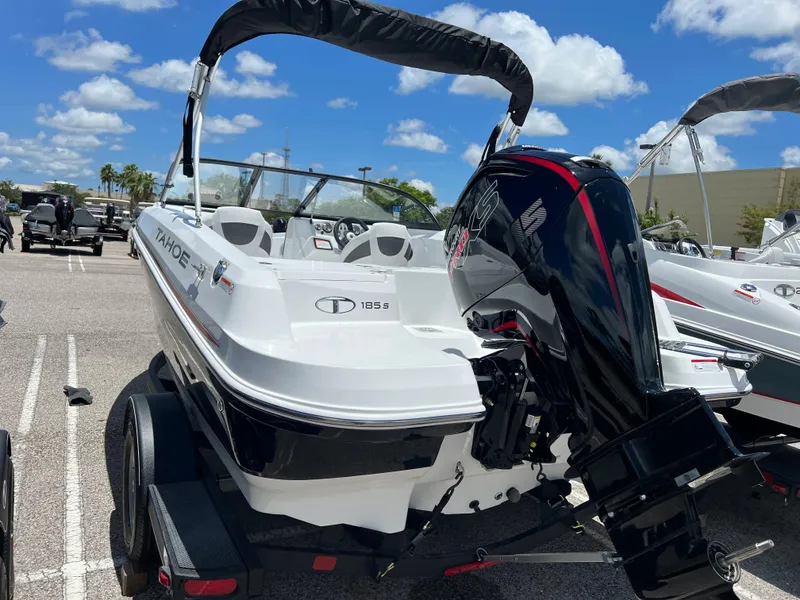 Slide: The Image of 2024 Tahoe 185 S boat with outboard motor in parking lot. - 3