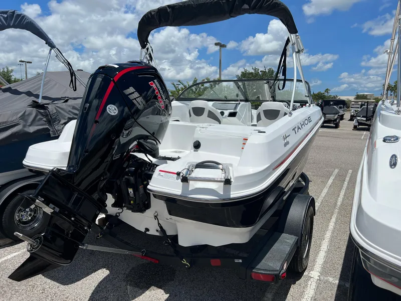 Slide: The Image of 2024 Tahoe 185 S boat with outboard motor in parking lot. - 4