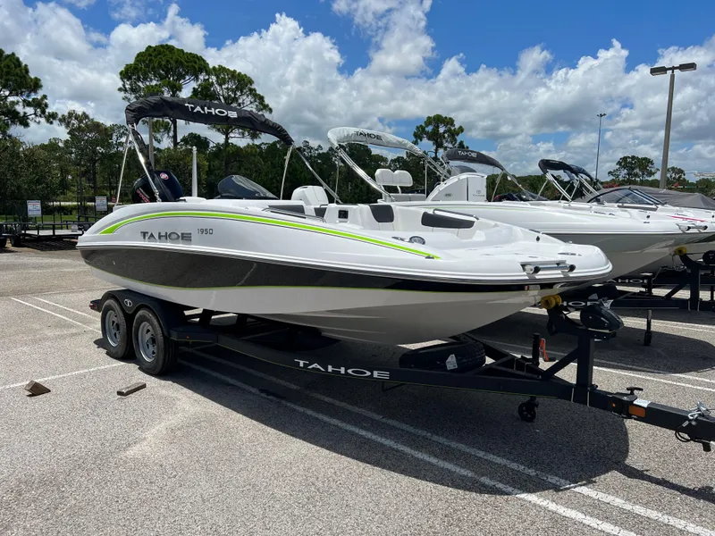 The Image of 2024 Tahoe 1950 boat on trailer in parking lot. - 0