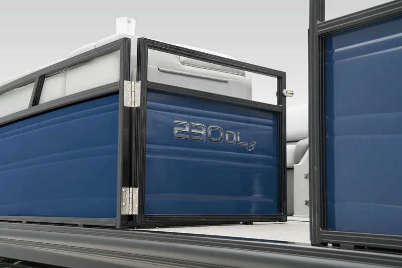 Slide: The Image of 2024 Regency 230 DL3 pontoon boat with blue paneling and open gate. - 11