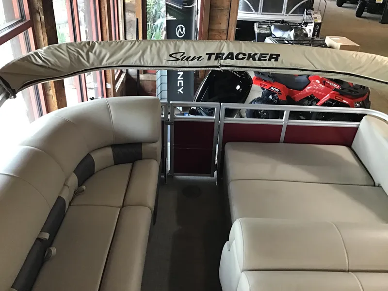 Slide: The Image of 2024 Sun Tracker Party Barge 22 RF XP3 interior with beige seating and canopy. - 4