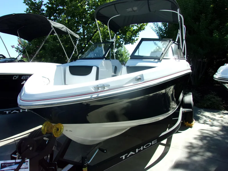 The Image of 2024 Tahoe 200 S boat with canopy on trailer, side view. - 0