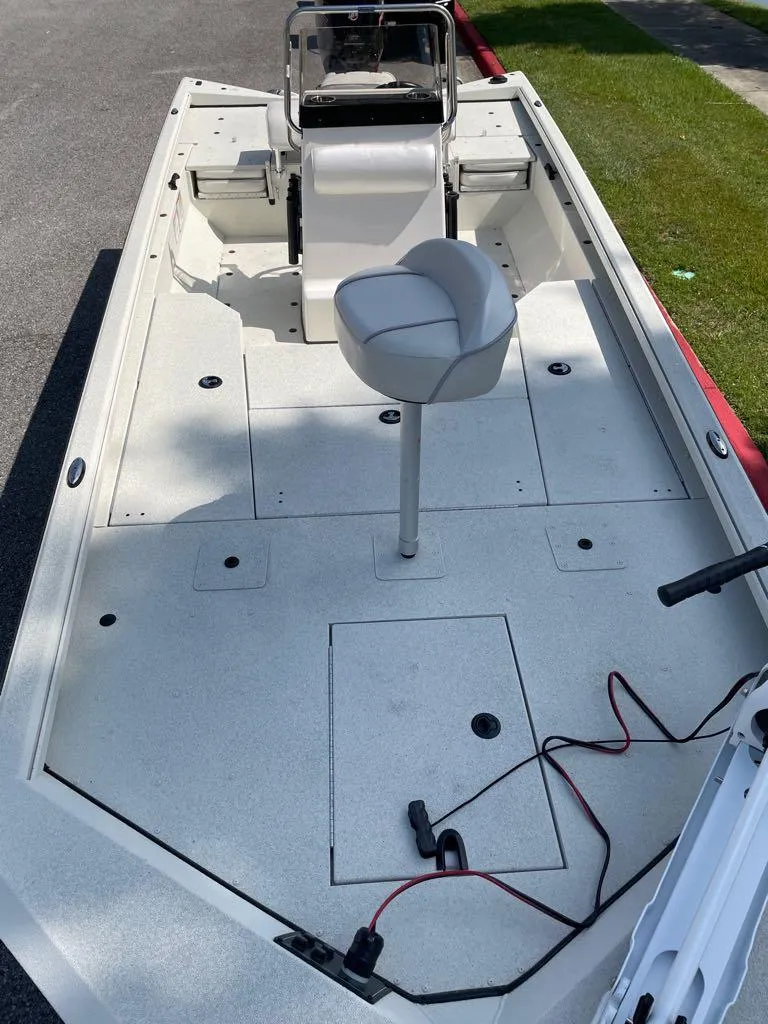 Slide: The Image of 2023 Ranger RB200 boat interior with seating and storage compartments. - 2