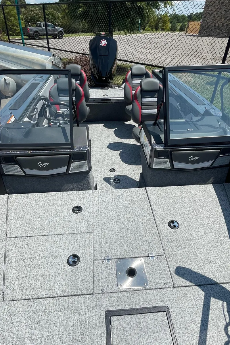 Slide: The Image of 2023 Ranger VX1788 WT fishing boat interior with dual consoles and seating. - 3