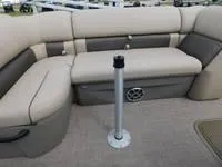 Slide: The Image of 2024 Sun Tracker Fishin' Barge 22 XP3 interior seating area with beige and gray upholstery. - 7