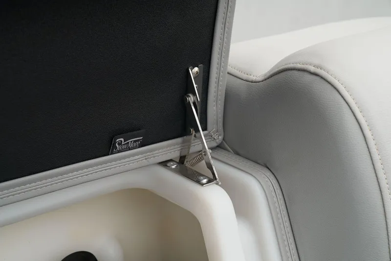 Slide: The Image of 2024 Regency 230 DL3 boat seat storage compartment with hinge and latch. - 30