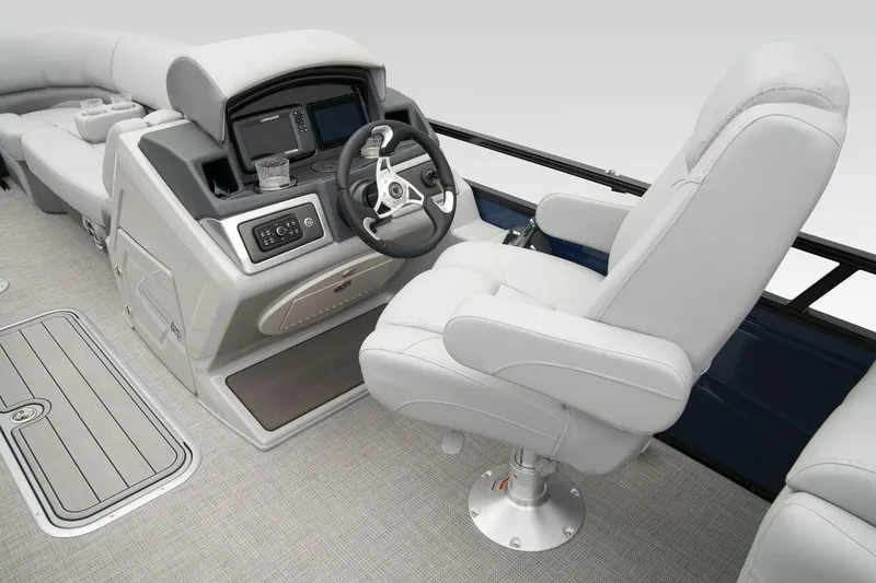 Slide: The Image of 2024 Regency 230 DL3 boat interior with captain's chair and control console. - 40