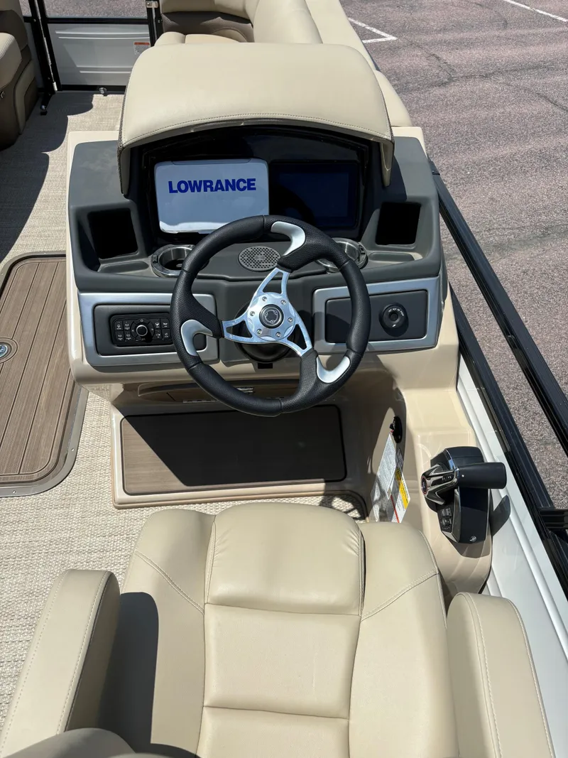 Slide: The Image of 2024 Regency 230 DL3 boat dashboard with Lowrance navigation system. - 7